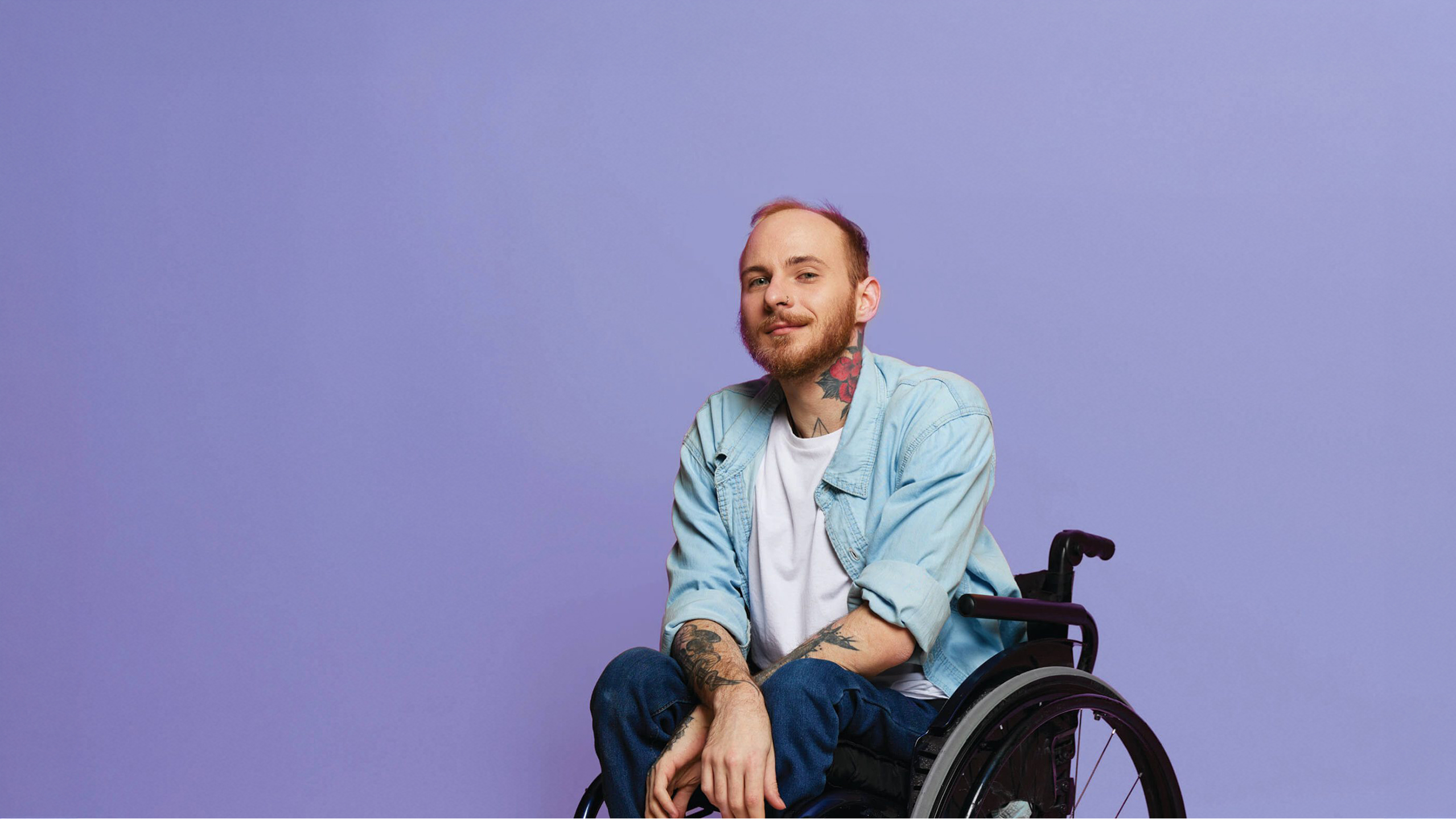 Person with a disability in a wheelchair receiving support through The People Project Tasmania’s disability services