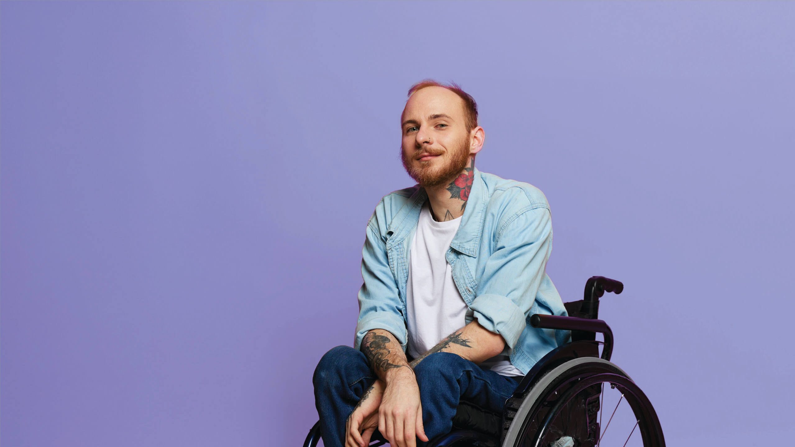 Person with a disability in a wheelchair receiving support through The People Project Tasmania’s disability services