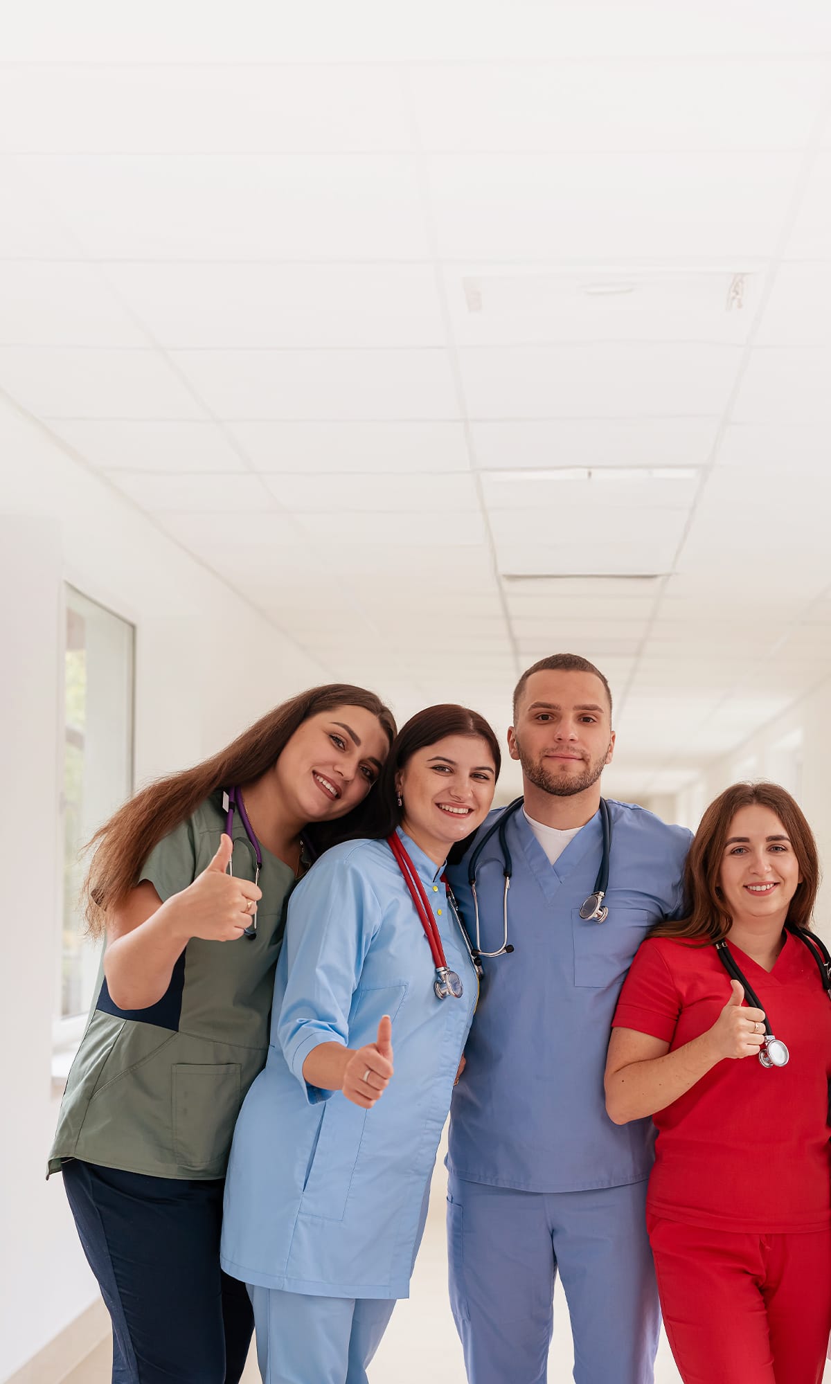 Group of nurses and doctors giving a thumbs up, representing graduate job opportunities and support from The People Project Tasmania