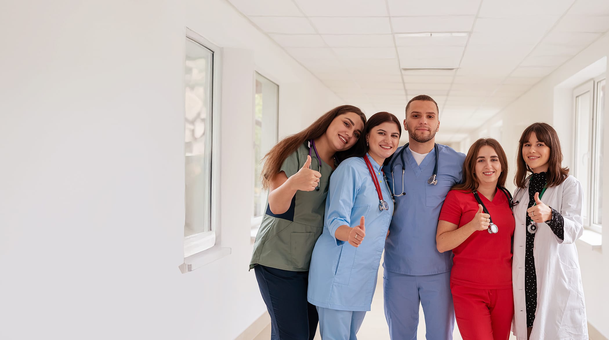 Group of nurses and doctors giving a thumbs up, representing graduate job opportunities and support from The People Project Tasmania